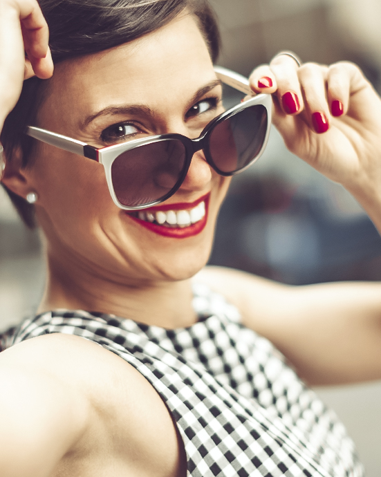 Woman wearing sunglasses and red lipstick